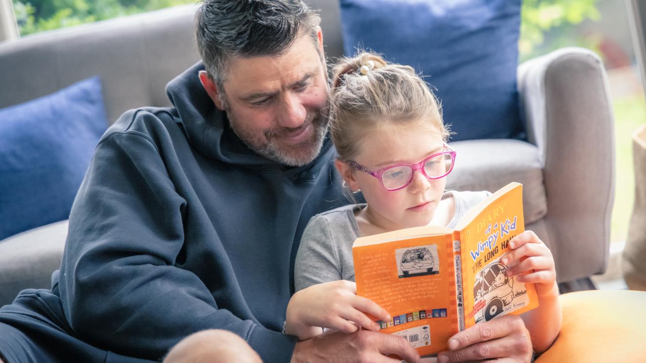 parent and child reading together