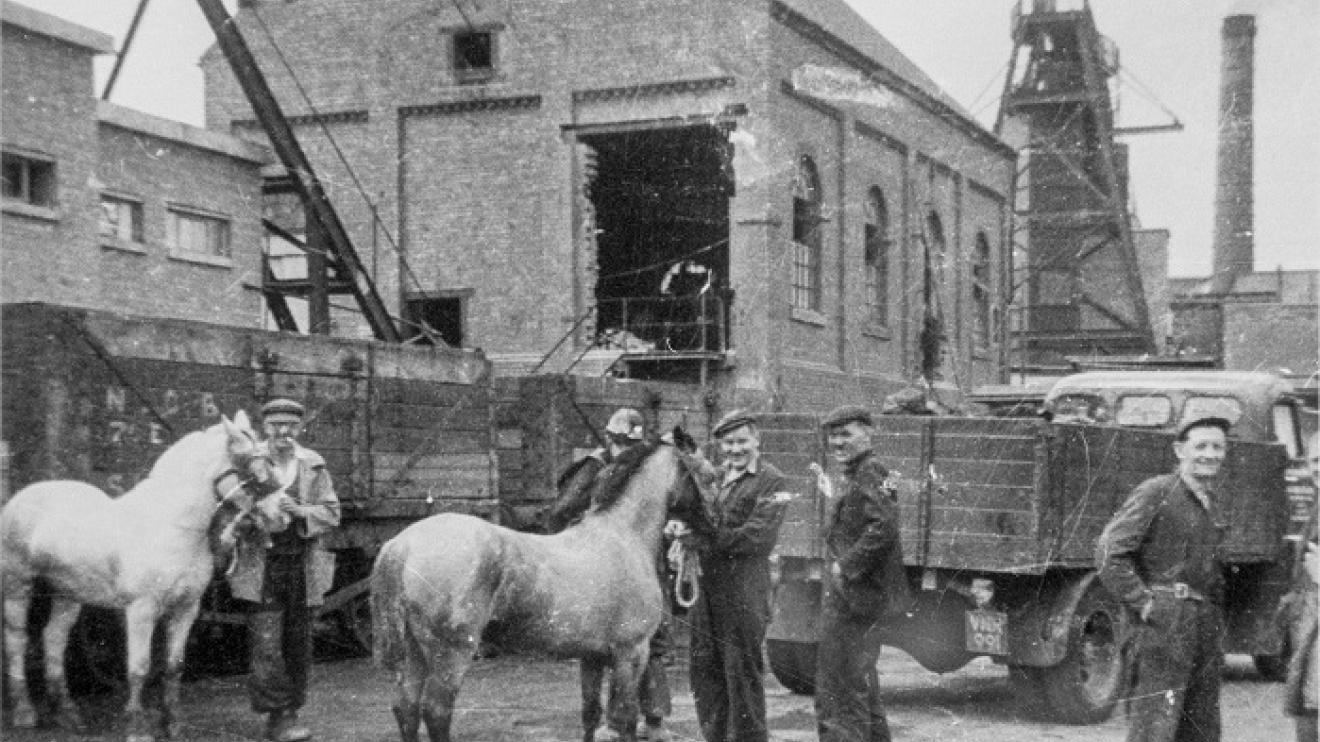 Workers with horses stood next to Snibston Colliery