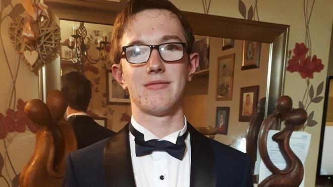 16 year old Tyler Hodgkinson wearing a dinner jacket and bow tie