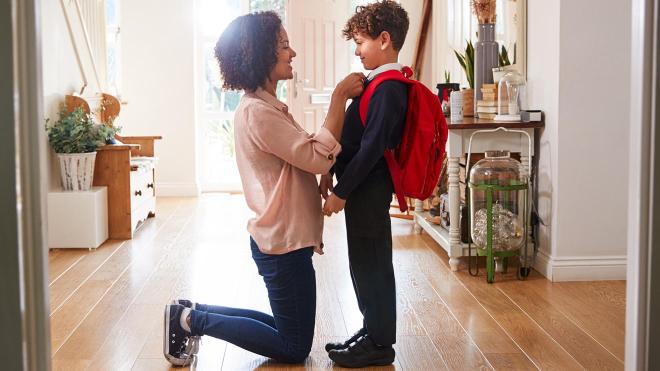 Mother prepares son for school 