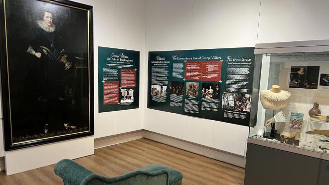 Exhibition space showing portrait of Villers and display boards