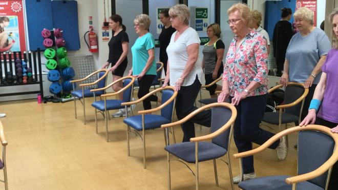 Group of older people doing exercise