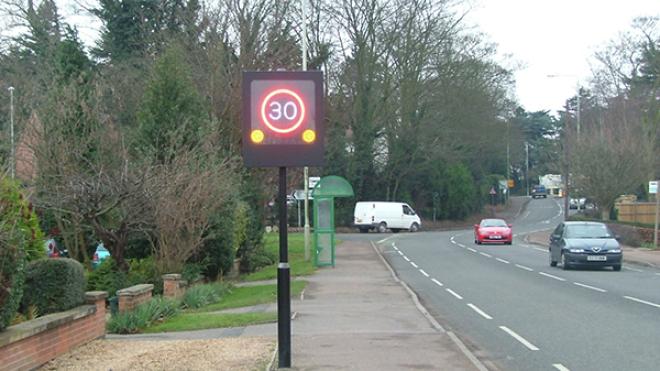 A flashing speed limit sign